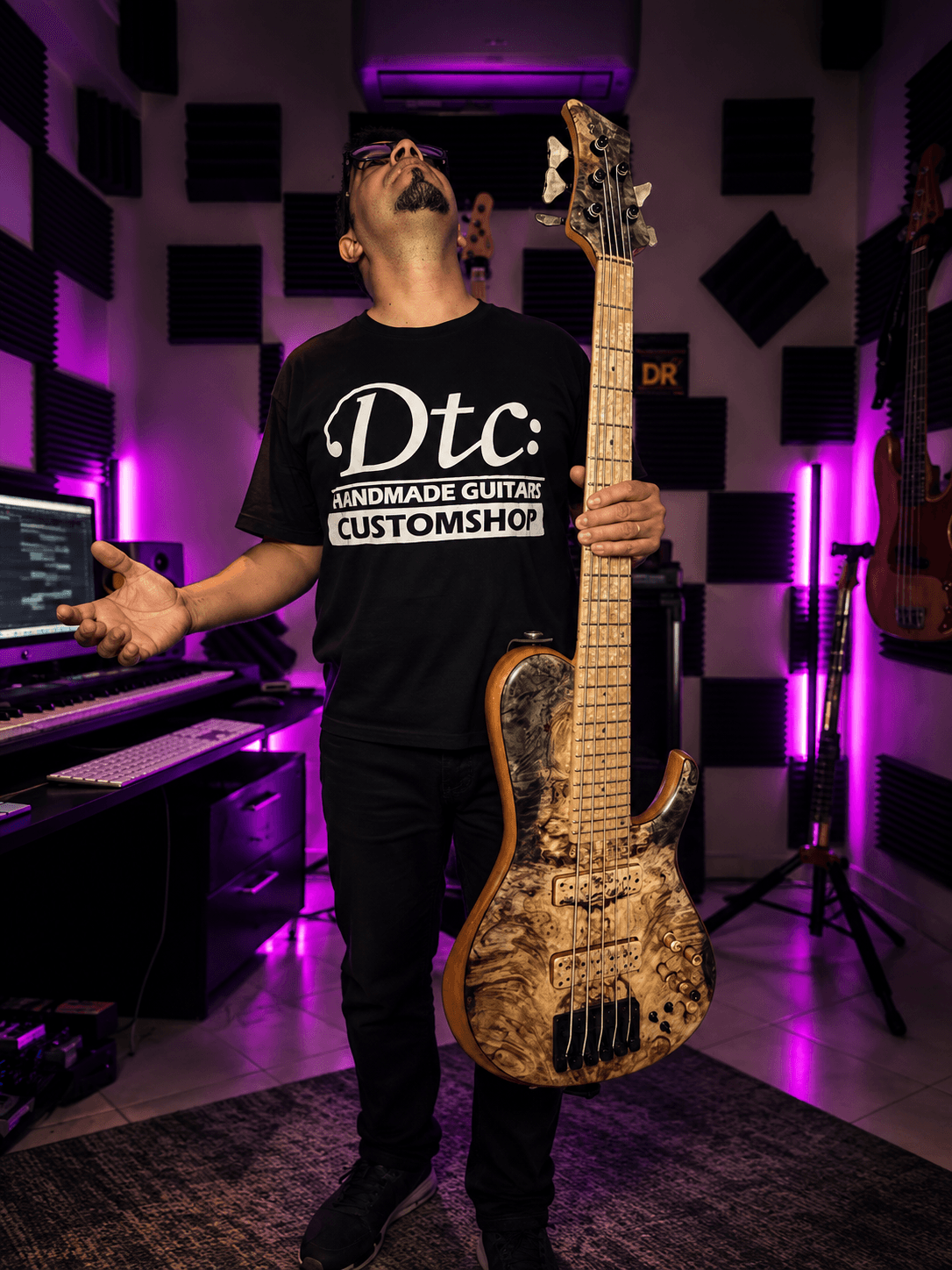 Mustapha Bouchou playing bass guitar